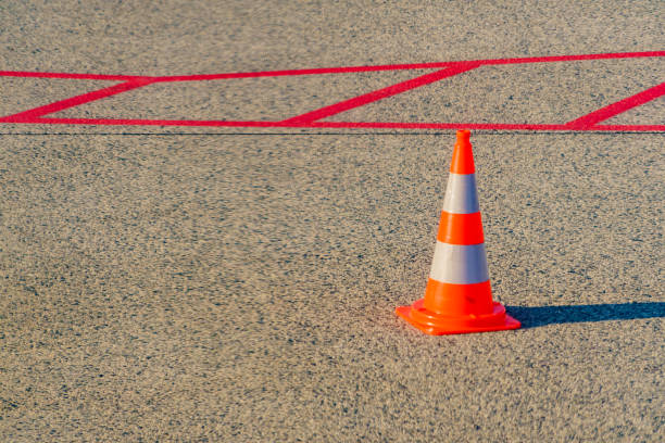 istock Orange traffic cone on airport 1406799823