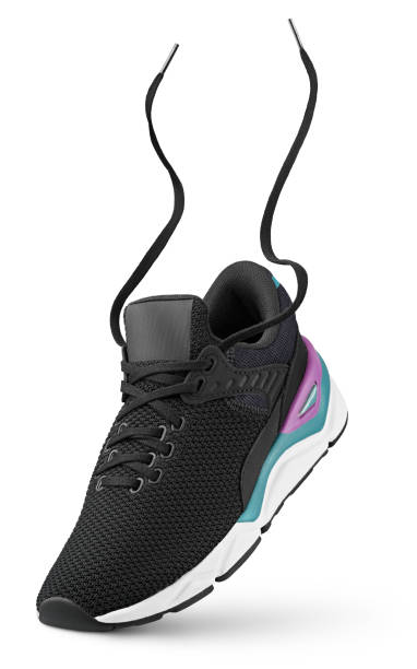 istock Black sneaker with flying laces stands on the tip isolated on white 1406801828