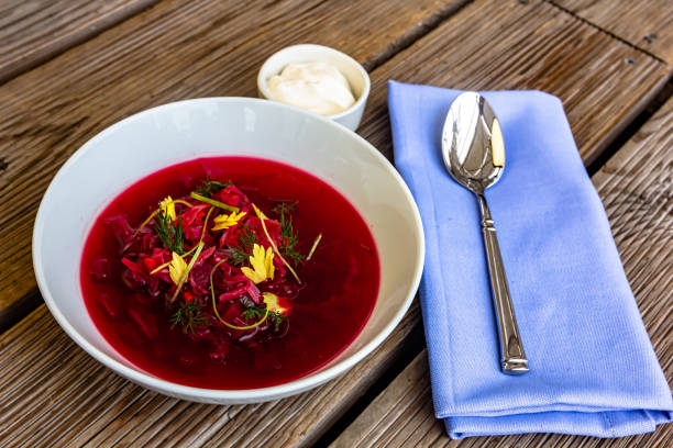istock Vegetable cold soup with beet, cucumber, radsih and egg on wooden table 1406803789