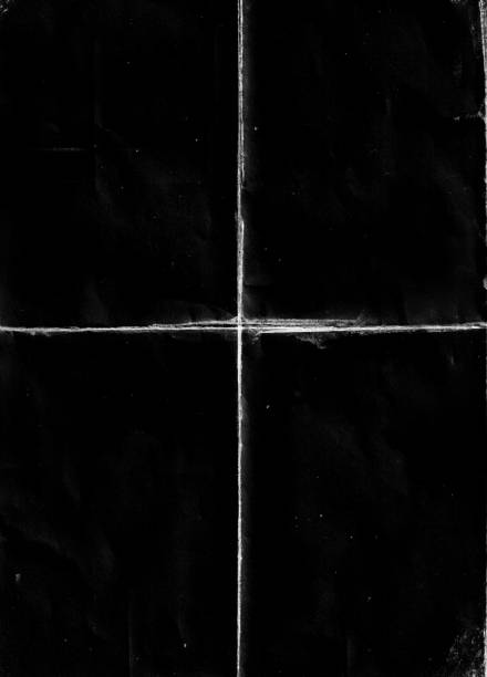istock Folded paper with grungy texture in black background. 1406807364