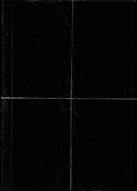 Folded paper with grungy texture in black background.