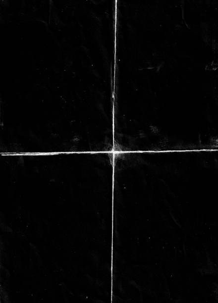 istock Folded paper with grungy texture in black background. 1406807404