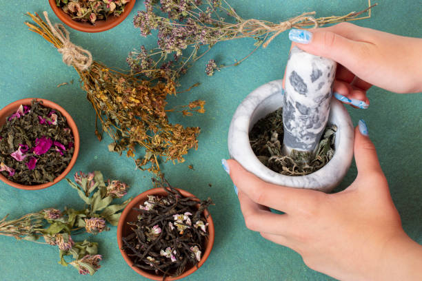 istock Grinding of dry herbs in mortar 1406807700