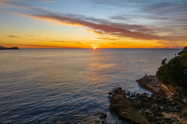 istock Sunrise over the sea with high cloud 1406809818