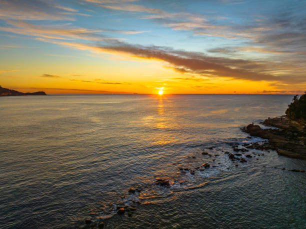 istock Sunrise over the sea with high cloud 1406809825