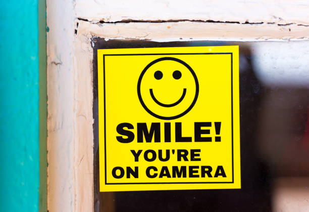 Yellow Sign Reading SMILE YOU'RE ON CAMERA