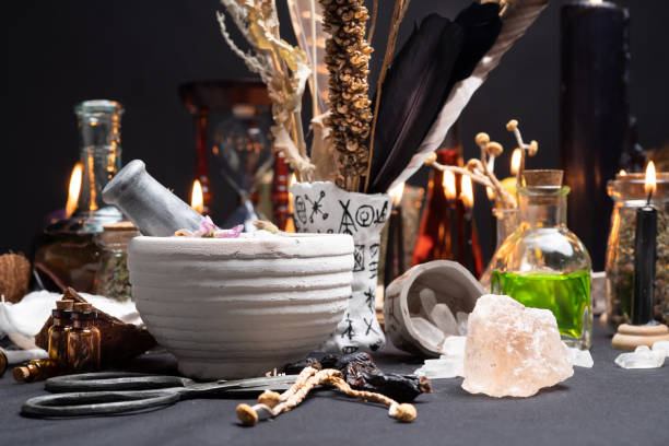 Mortar and pestle witchcraft alchemy still life selective focus, witch craft pharmacy and medicine. Spiritual occultism chemistry, magic alchemy and ritual arrangement. stock photo