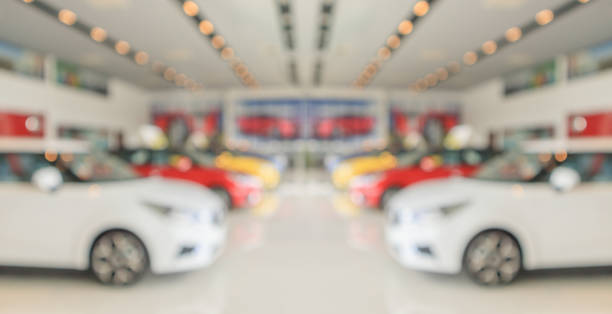 istock new cars in showroom interior blurred abstract background 1406814610