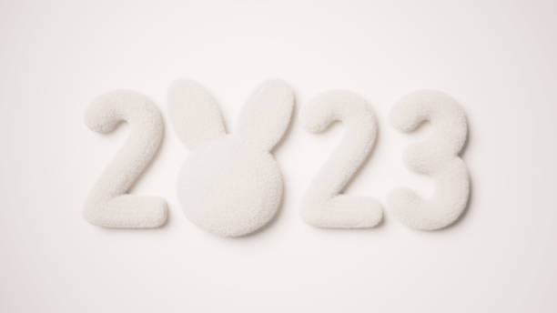 3D レンダリング。白い背景に 2023 という数字。ウサギの形。年賀状。(水平)