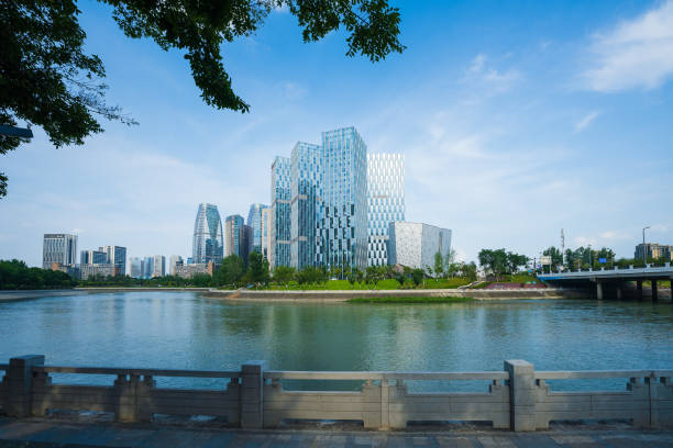 istock Riverside bridge and modern urban architecture in sunny days 1406817857