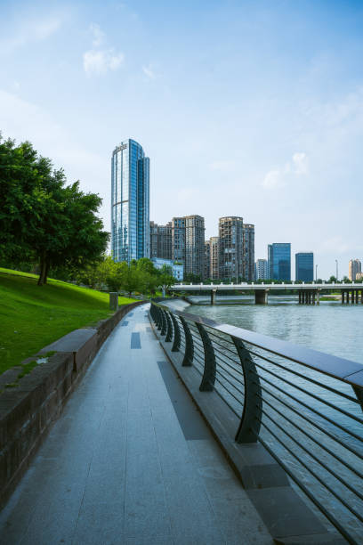 istock Riverside bridge and modern urban architecture in sunny days 1406819075