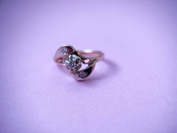istock Gold diamond ring on pink isolated background. Red Gold Ring 1406819096