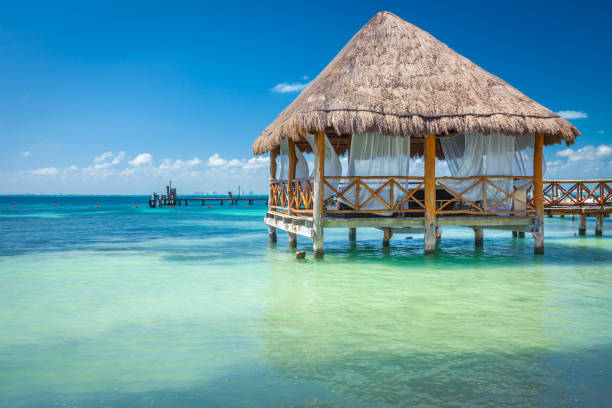 Relaxing Palapa in Caribbean sea - Isla Mujeres, Cancun -Mexico Relaxing Palapa in Caribbean sea - Isla Mujeres, Mexico isla mujeres stock pictures, royalty-free photos & images