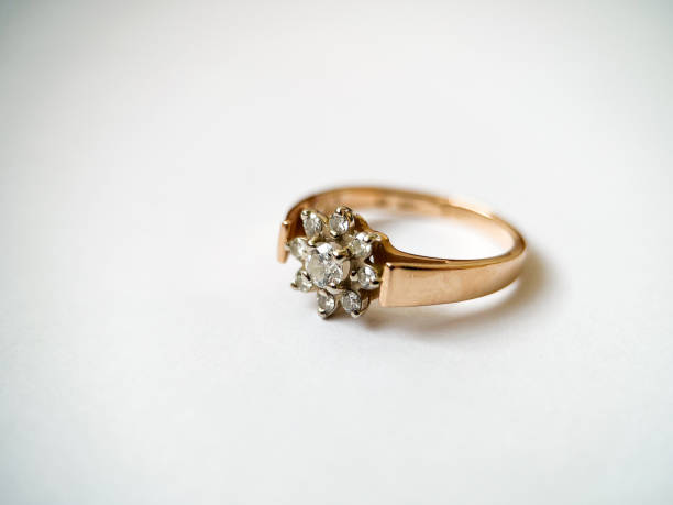 istock Gold diamond ring on a white isolated background. Red Gold Ring 1406819163