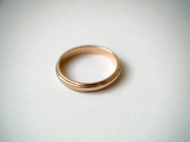 istock Gold wedding ring on a white isolated background. Red and white gold ring 1406819168