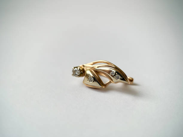 istock Gold earrings with diamonds close-up 1406819724
