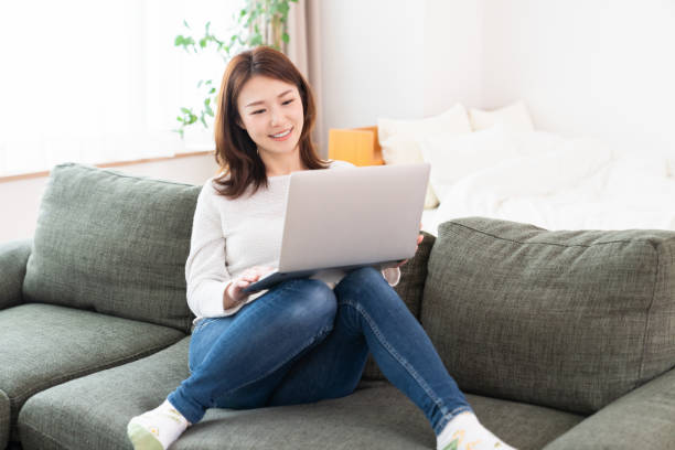 istock young asian woman using laptop 1406822371