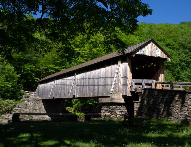 istock Wooden country covered bridge on a sunny day 1406825124