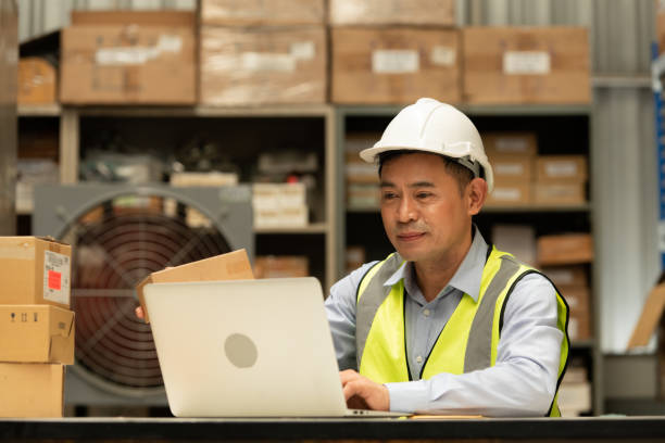 istock Warehouse Manager, Thinking and reviewing the preparation of products that must be distributed to retailers during the price increase in the market. 1406830204
