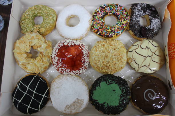 istock Close up of colorful donuts 1406831306