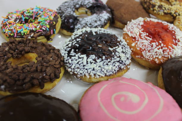 istock Close up of colorful donuts 1406831316