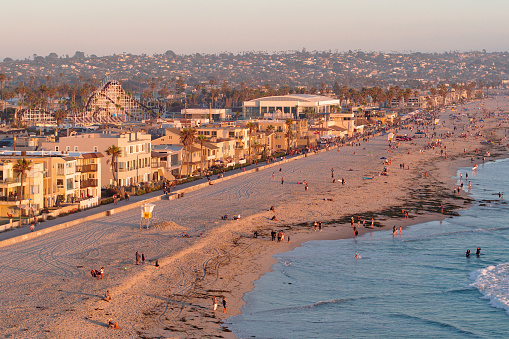 Lifeguard Tower with people enjoying the sun and the beach with ocean waves in La Jolla, California, Located in San Diego County.