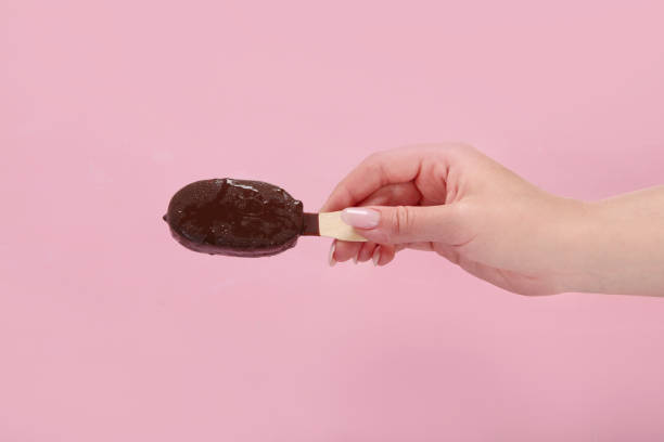 istock Popsicle ice-cream assortment on pink background. 1406837139