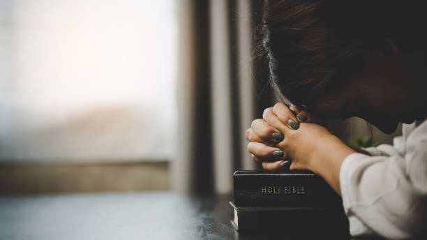 istock A woman praying worship believe 1406839729