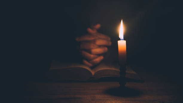 istock Woman hands praying on holy bible 1406839741