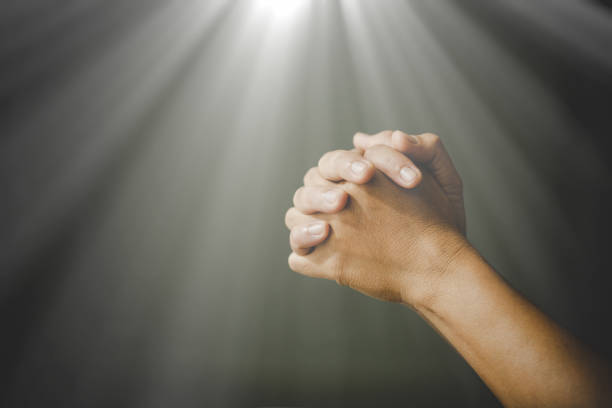 istock woman hands praying to god 1406839760