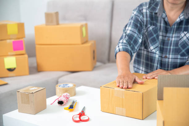 istock Women working freelance and packing box 1406839814