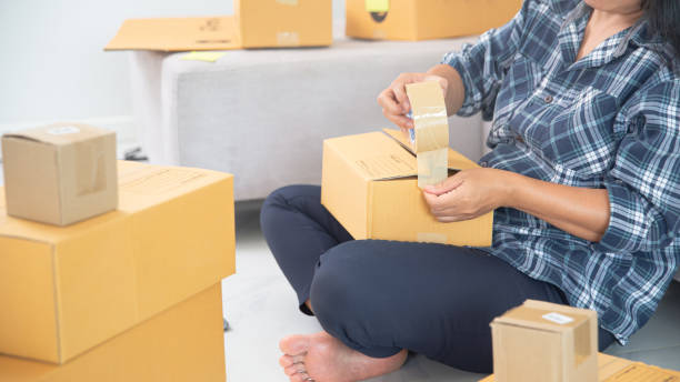 istock Women working freelance and packing box 1406840376