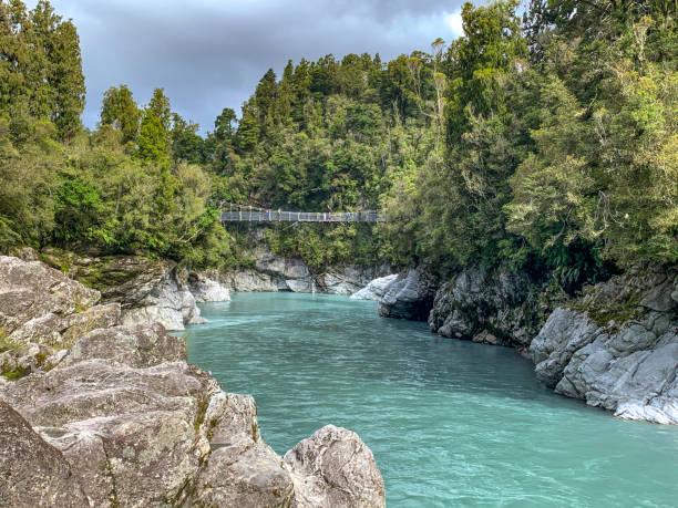 Swing bridge crossing to beautiful Hokitika Gorge Scenic Reserve , Hokitika , South Island of New Zealand stock photo