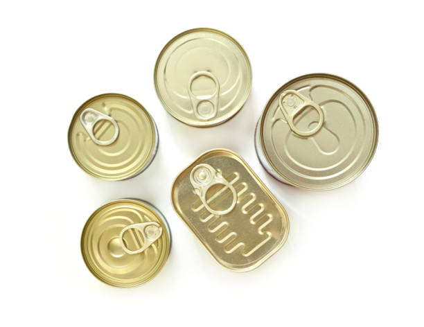 Close up of various canned food on white background.