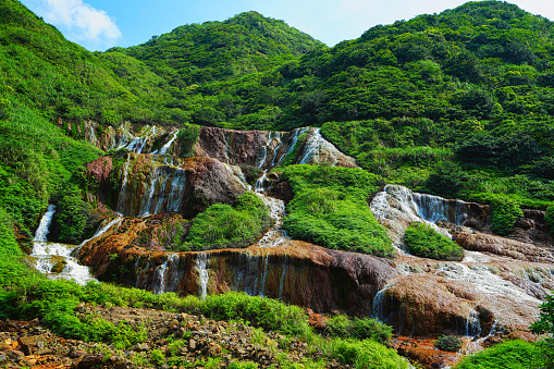 Golden Waterfall, formed by the interaction of groundwater and iron sulfide ore. It is close to the popular tourist village of Jiufen, on the northeastern coast of Taiwan.