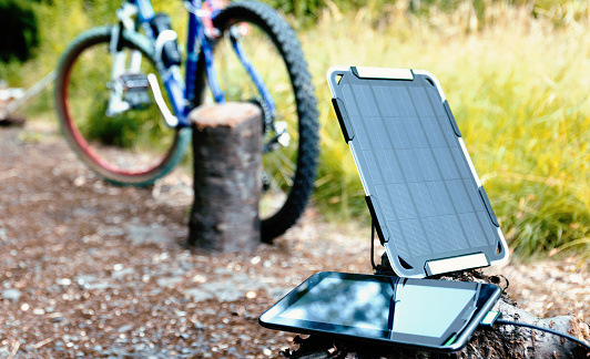 Portable solar charging technology idea. Concept of renewable energy.