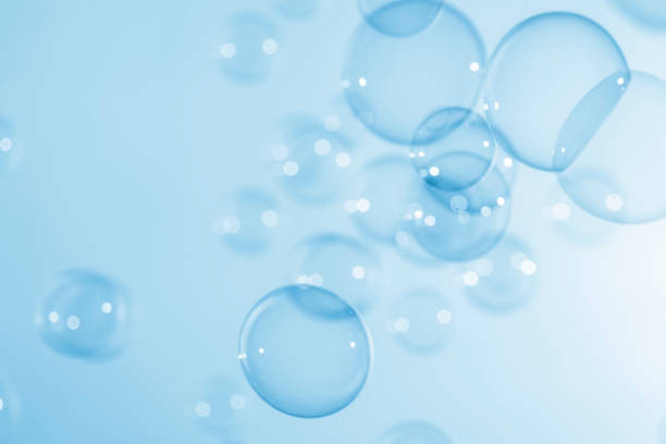 istock Abstract Beautiful Transparent Blue Soap Bubbles Background. Soap Sud Bubbles Water 1406847773