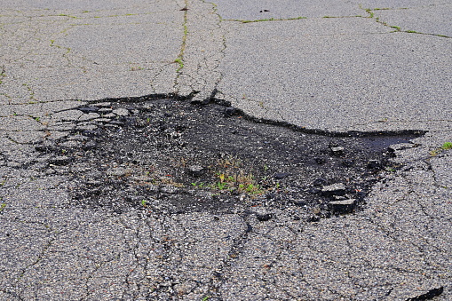 damaged asphalt roadway cement broken