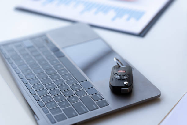 istock car keys placed on keyboard, car insurance concept computer 1406849576