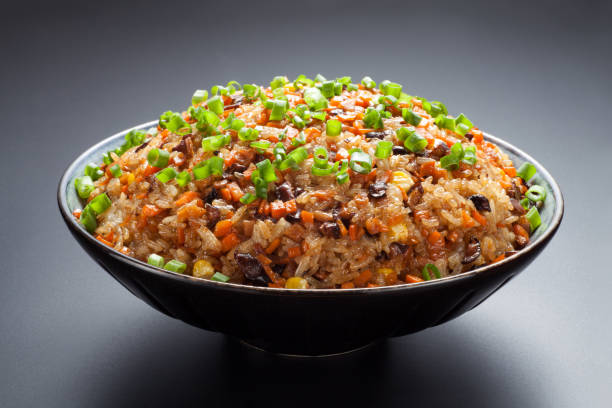 Cantonese fried glutinous rice with mushroom, corn, carrots and sausage. Cantonese fried glutinous rice with mushroom, corn, carrots and sausage. Chinese Food. cantonese cuisine stock pictures, royalty-free photos & images