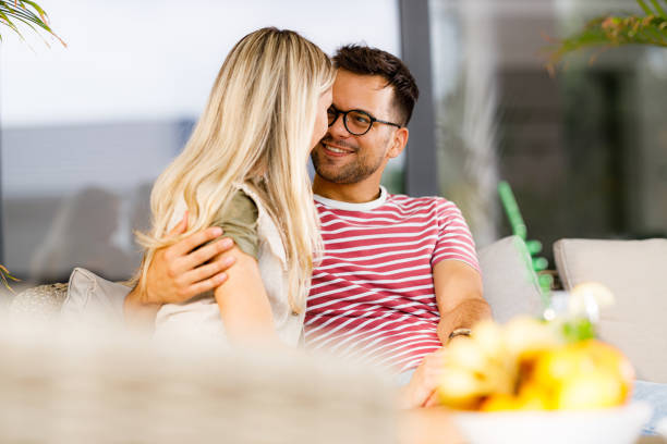 istock Young couple in love talking on a patio. 1406852498