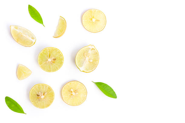 istock Lemon slices with green leaves on white background 1406853237