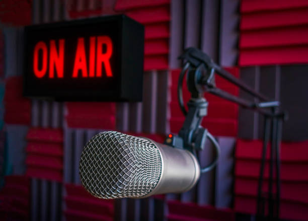 istock Professional microphone and on air sign 1406853523