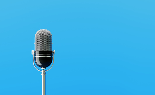Microphone on blue background. Horizontal composition with copy space.