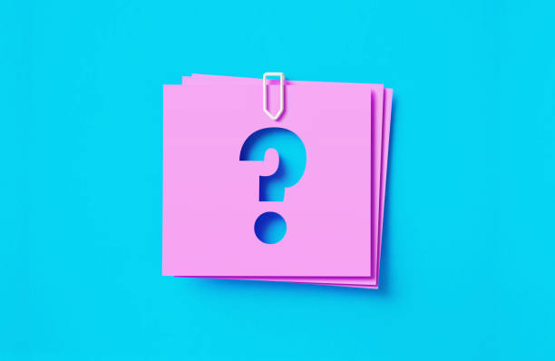 Question Mark Written Cut Out Pink Adhesive Notes Sitting Over Blue Background Question mark written cut out pink adhesive notes sitting on blue background. Horizontal composition with copy space. frequently asked questions stock pictures, royalty-free photos & images