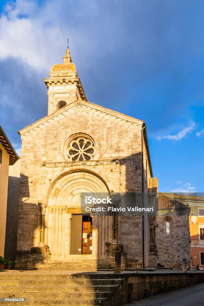 San Quirico d'Orcia, Collegiate Church of San Quirico - Tuscany Collegiate church of San Quirico in San Quirico d'Orcia, rebuilt into the current structure in the 12th century Architecture Stock Photo