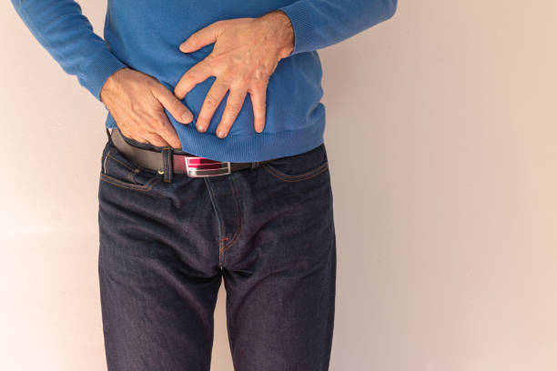 istock Old man feeling big discomfort in stomach. 1406857179