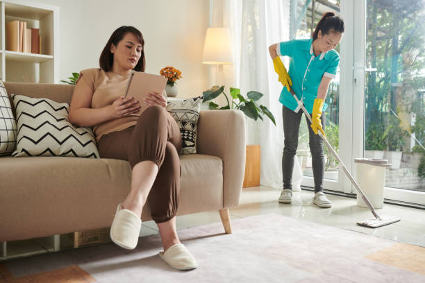 istock Woman trusting housework to professionals 1406859533