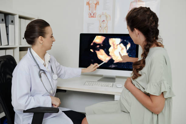 istock Gynecologist discussing baby scan with patient 1406860357