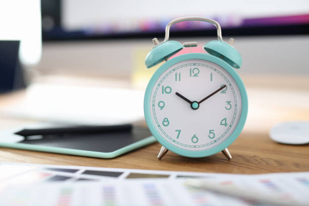 Alarm clock for ten o'clock at workplace in office